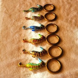 6 movable napkin rings   hand painted  Seahorses in various shades